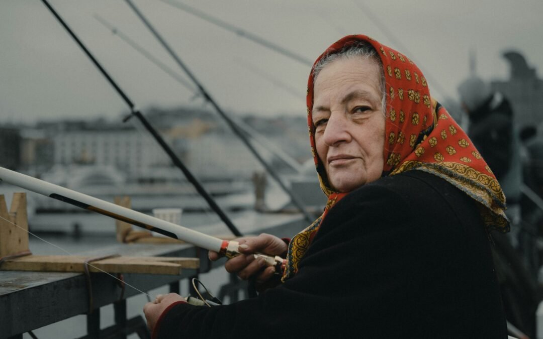 woman fishing on bridge